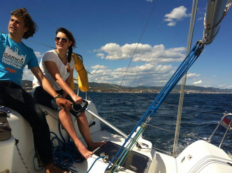 Sailing and teaching how to sail in front of Barcelona coast line