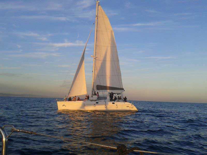 Catamaran sailing tour in sunset for the Barcelona Coast