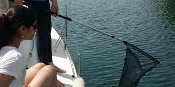fishing plastic while sailing n Barcelona